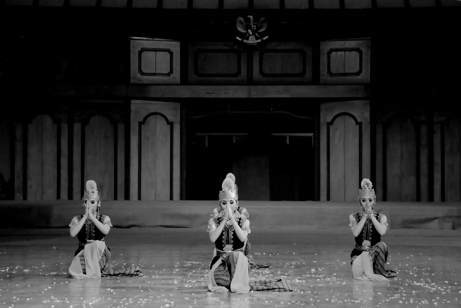 a group of women sitting on top of a dance floor