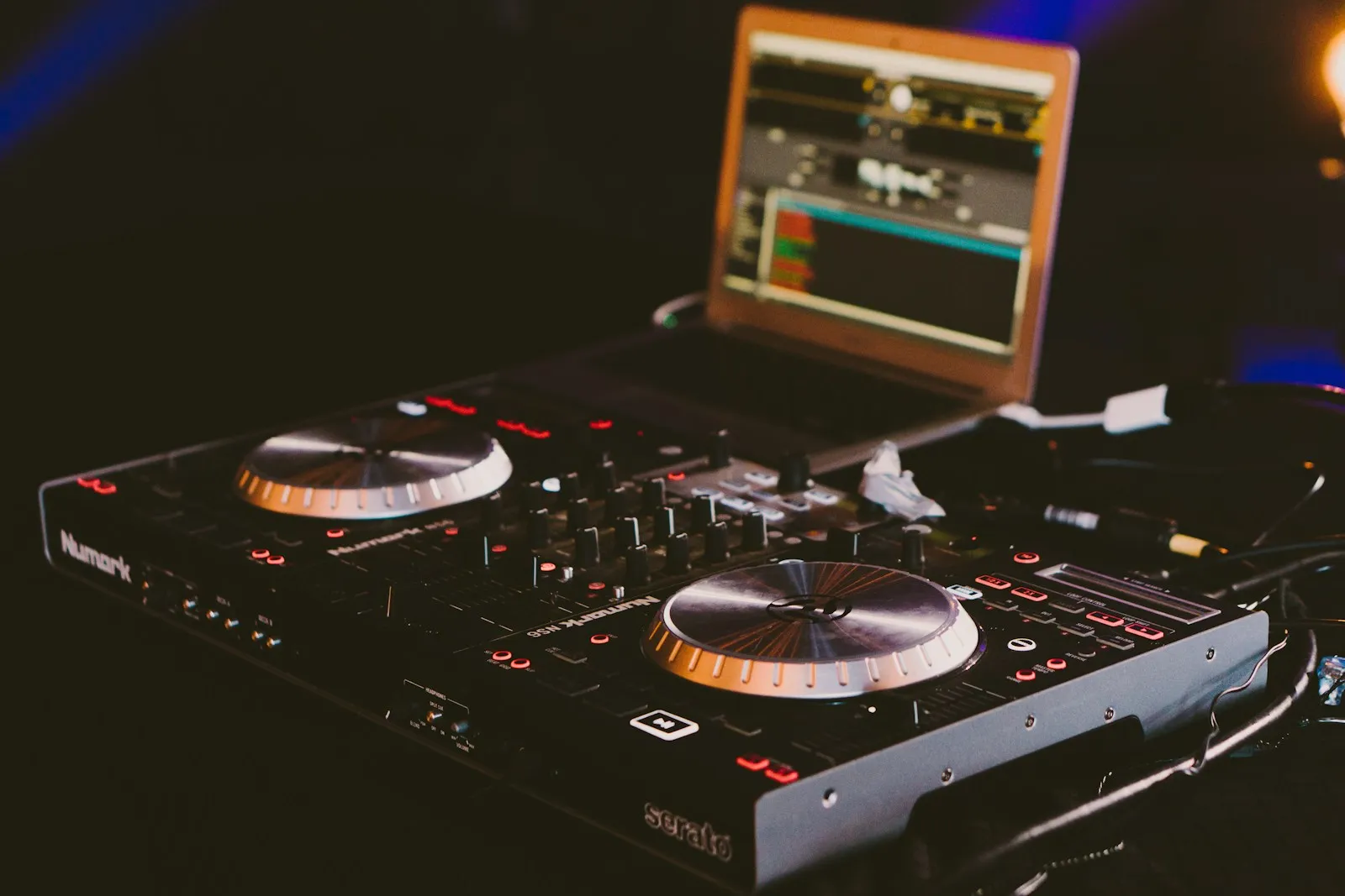 black DJ turn table next to laptop computer