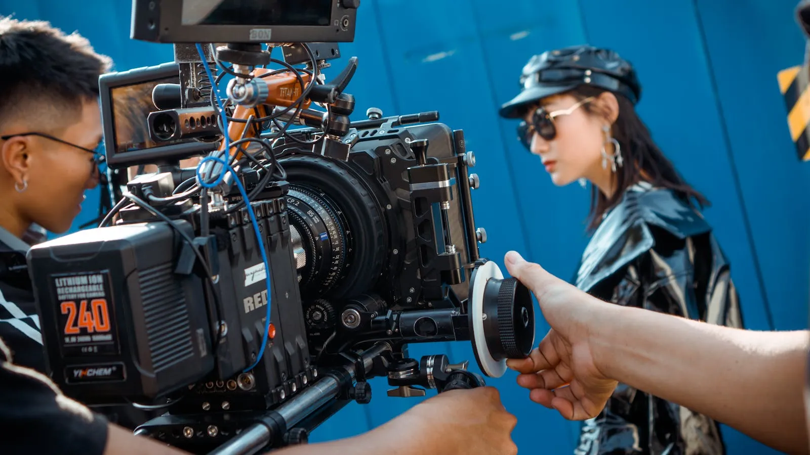 Close-up of a professional video production setup on an outdoor film set.