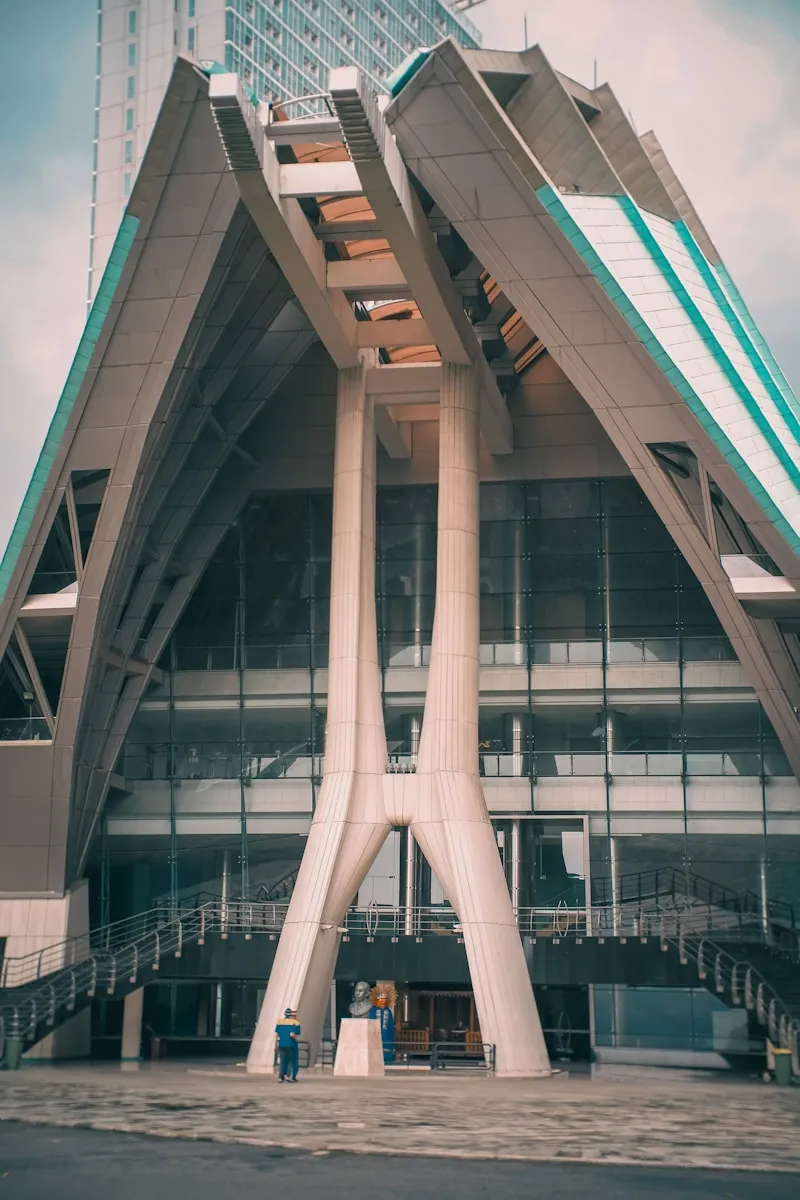 a tall building with a spiral staircase going up it's side