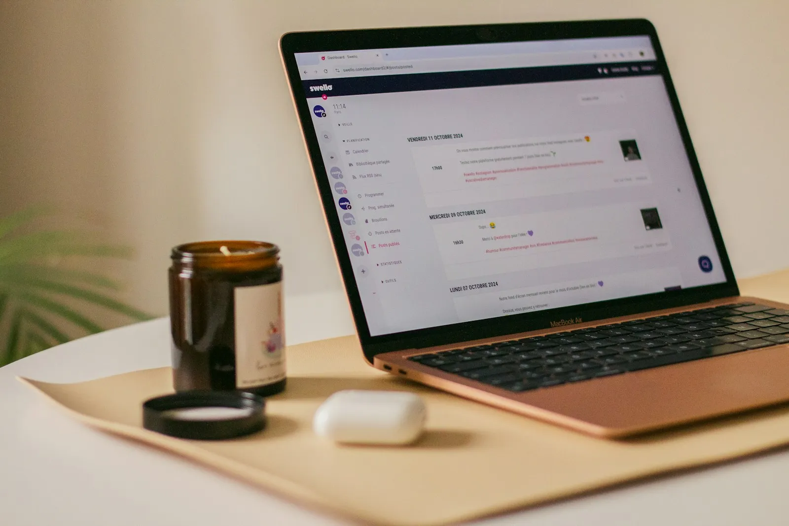 A laptop computer sitting on top of a wooden table